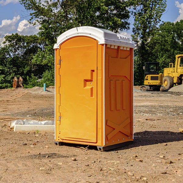 what is the cost difference between standard and deluxe portable restroom rentals in Oilton